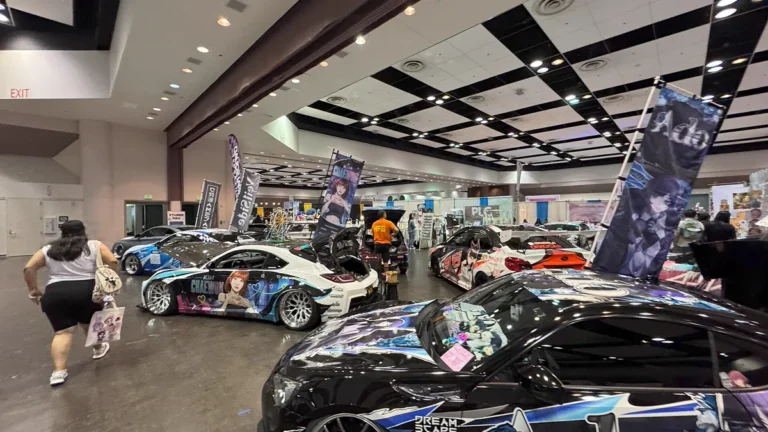 Front view of customized vehicle featuring full anime car wrap graphics