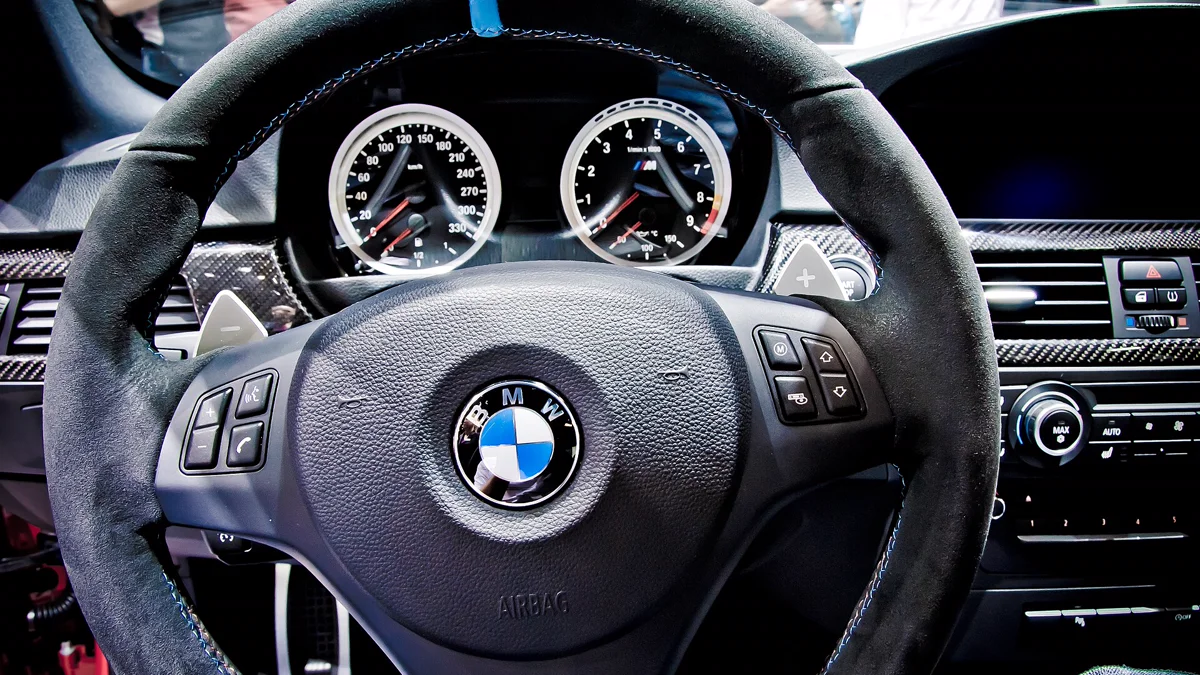 Cockpit overview showing custom car interior styling on sports steering wheel and dash