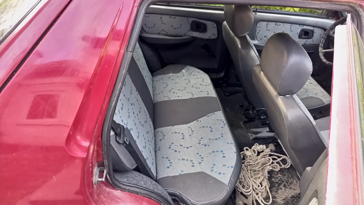 Clean fabric upholstery and patterned cloth car seats Passenger compartment view showing clean dry woven cloth car seats