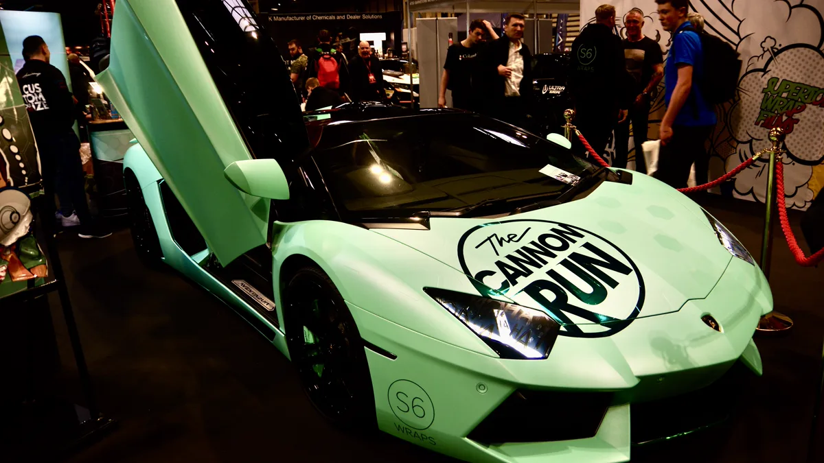 Completed full vehicle color change wrap displayed at an automotive enthusiast gathering