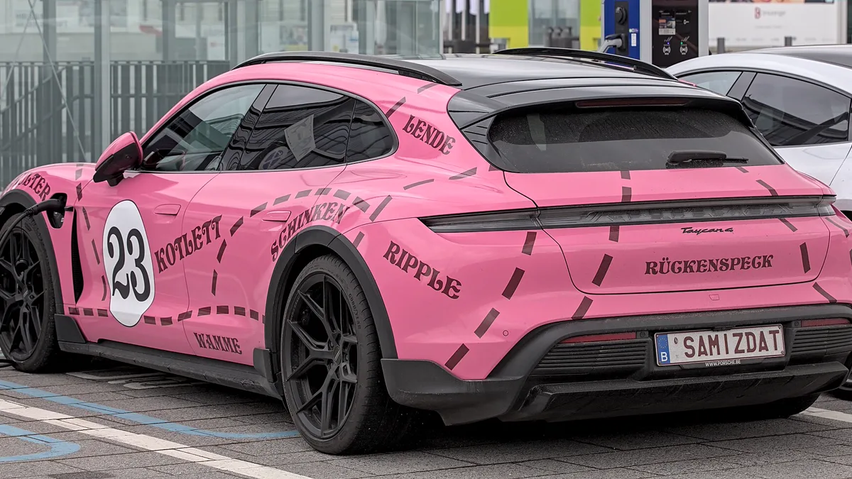 High durability exterior vinyl wrap on vehicle parked in daily outdoor conditions Full exterior view of wrapped vehicle outdoors illustrating how long does a car wrap last on a daily driver