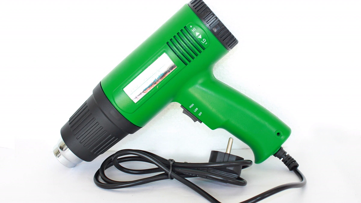 Professional hot air heat gun tool for vehicle vinyl decal softening Heat gun tool demonstrating how to remove car decals by warming adhesive