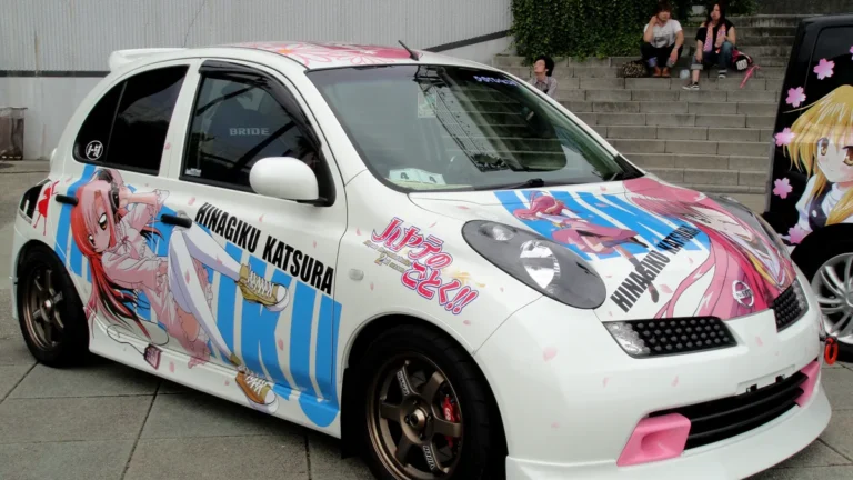 Front view of an itasha car showing detailed anime hood vinyl wrap graphics